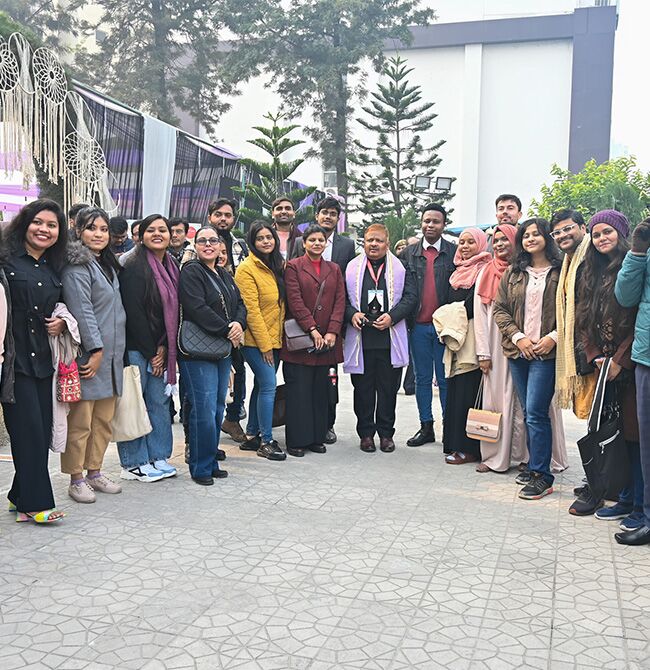 Volunteers gathering on the lawn during Metaphor Lucknow Litfest.